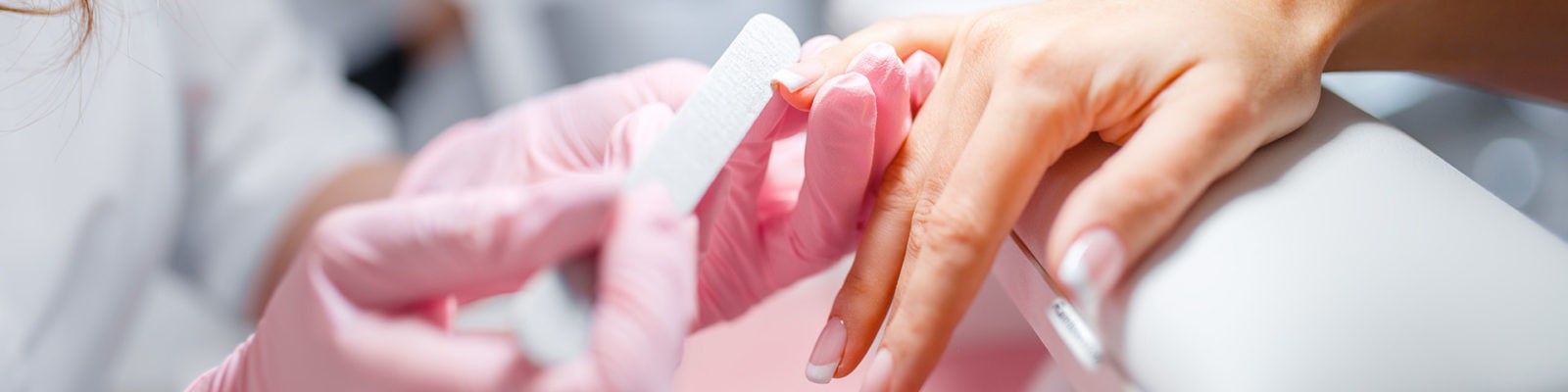 A person is getting their nails done