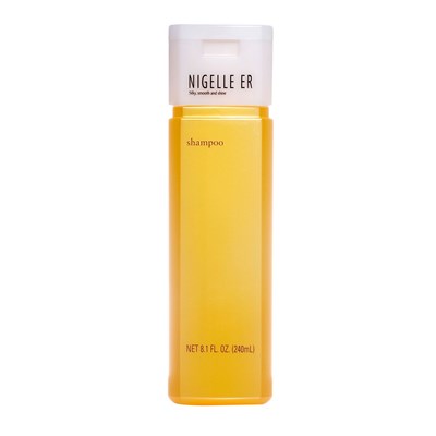 nigelleershampoo81retailcopy A bottle of orange liquid with white cap.